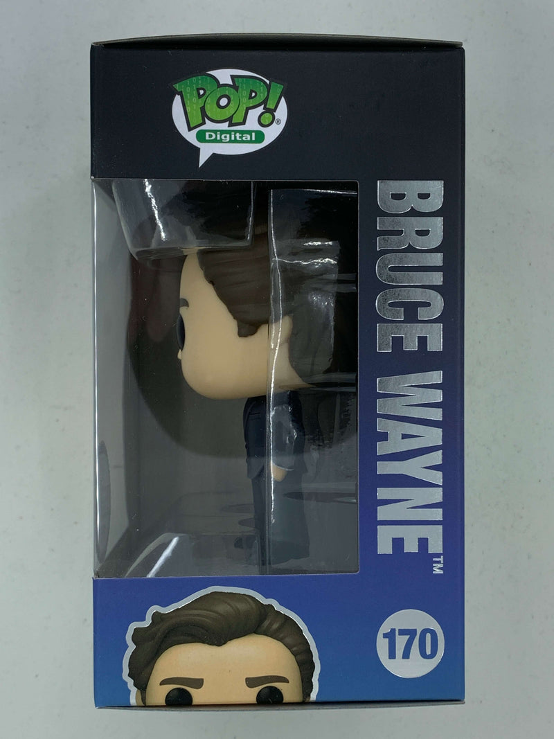 Stylized NFT digital collectible figure of Bruce Wayne from The Dark Knight, limited edition with only 1900 pieces, displayed in its original packaging
